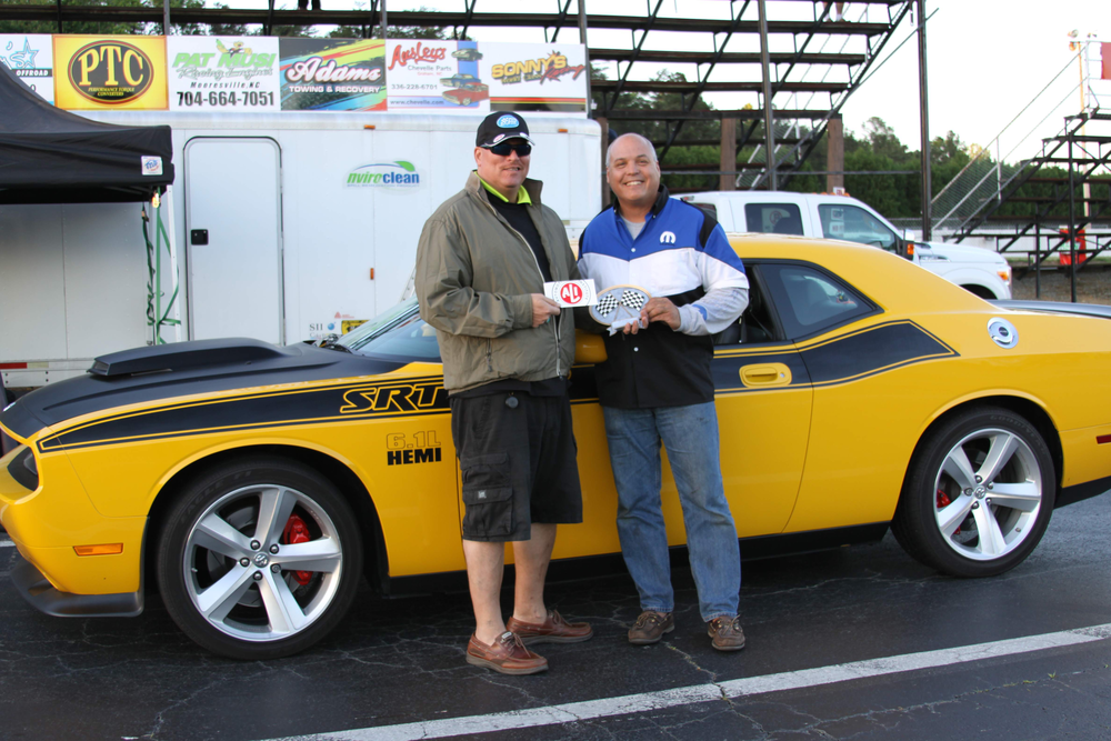 ALI President R.W. 'Bob' O'Gorman presents the trophy for 2013 Spring Fling Drag Race Experience Bracket Race Winner to Robert Moore.