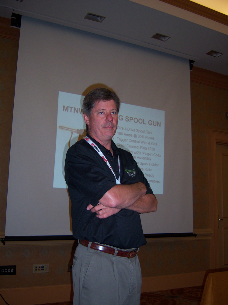 Mike Cooper of Nu-Tec Systems reviews Mountain and Monster brand welding tools during the ISN dealer expo in Orlando, Fla.