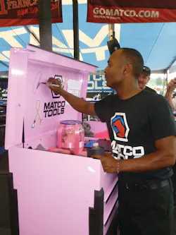 Matco Tools dragster Antron Brown signs the pink Matco Toolbox that was a raffle prize in a fund raiser for breast cancer awareness. Matco Tools dragster Antron Brown signs the pink Matco Toolbox that was a raffle prize in a fund raiser for breast cancer awareness.