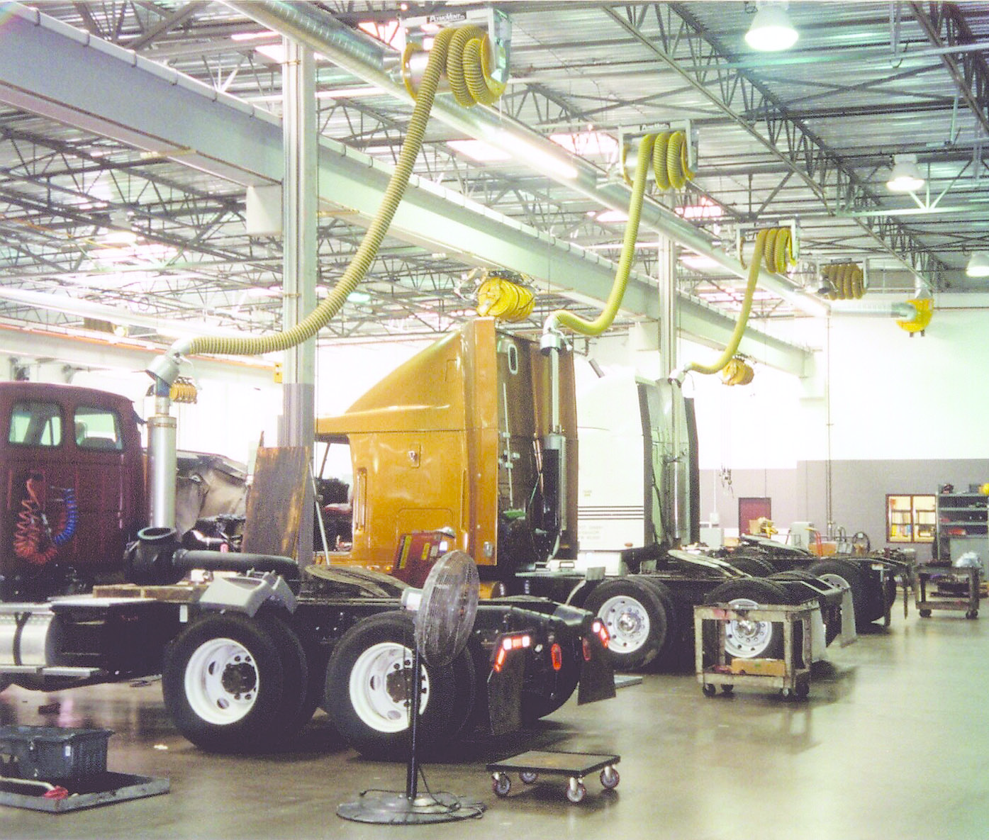 Among the methods for eliminating hazardous exhaust emissions in vehicle shops are at-the-source capture systems which essentially become an extension of the tailpipe and convey the fumes outside.