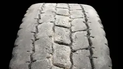 (SECTION 1: Irregular drive tire conditions) 1. Multiple Cuts/Chunking Appearance: Numerous small cuts to the tread surface with portions of tread removed, giving a rough appearance. Probable Cause: Vehicle operation on rough surfaces (misapplication of tread compound). Corrective Action: Review tire selection and operation. Tire Disposition: Minor damage should return to service. Consult retreader for possible repair and retread. (SECTION 1: Irregular drive tire conditions) 1. Multiple Cuts/Chunking Appearance: Numerous small cuts to the tread surface with portions of tread removed, giving a rough appearance. Probable Cause: Vehicle operation on rough surfaces (misapplication of tread compound). Corrective Action: Review tire selection and operation. Tire Disposition: Minor damage should return to service. Consult retreader for possible repair and retread.