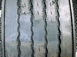 (SECTION 3: Irregular steer tire conditions) 7. Multiple Flat Spotting Wear Appearance: Multiple radially worn areas around the tire. Probable Cause: Faulty shocks, loose/worn wheel bearings, severe balance issues, mismatched pressures or tire diameters, excessive high speed empty operation. Corrective Action: Check for mechanical issue, check air pressure. Tire Disposition: Continue to run or retread. (SECTION 3: Irregular steer tire conditions) 7. Multiple Flat Spotting Wear Appearance: Multiple radially worn areas around the tire. Probable Cause: Faulty shocks, loose/worn wheel bearings, severe balance issues, mismatched pressures or tire diameters, excessive high speed empty operation. Corrective Action: Check for mechanical issue, check air pressure. Tire Disposition: Continue to run or retread.