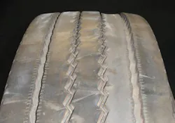 (SECTION 2: Irregular trailer tire conditions) 1. Depression Wear (Intermediate) Appearance: One or more interior ribs (not center) worn below adjacent ribs around the tire’s circumference. Probable Cause: Worn suspension components, mismatched dual diameter or inflation pressures, underinflation, improper bearing adjustment. Aggravated by high speed/light loads. Corrective Action: Diagnose mechanical condition and correct. Tire Disposition: Continue to run until pull point, then retread. (SECTION 2: Irregular trailer tire conditions) 1. Depression Wear (Intermediate) Appearance: One or more interior ribs (not center) worn below adjacent ribs around the tire’s circumference. Probable Cause: Worn suspension components, mismatched dual diameter or inflation pressures, underinflation, improper bearing adjustment. Aggravated by high speed/light loads. Corrective Action: Diagnose mechanical condition and correct. Tire Disposition: Continue to run until pull point, then retread.