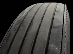 (SECTION 2: Irregular trailer tire conditions) 4. Depression Wear (Shoulder) Appearance: Localized areas of wear in shoulder, generally less than 12” in length. Probable Cause: Improper inflation pressure or tire mismounted on wheel. Can also be caused by some other type of wheel-end imbalance. Corrective Action: Review tire and wheel-end maintenance practices. Tire Disposition: Continue to run until pull point, then retread. (SECTION 2: Irregular trailer tire conditions) 4. Depression Wear (Shoulder) Appearance: Localized areas of wear in shoulder, generally less than 12” in length. Probable Cause: Improper inflation pressure or tire mismounted on wheel. Can also be caused by some other type of wheel-end imbalance. Corrective Action: Review tire and wheel-end maintenance practices. Tire Disposition: Continue to run until pull point, then retread.
