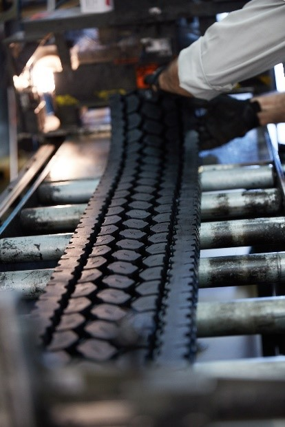 The precure method of retread application uses a pre-formed and cured tread, either in a strip or full circle, and attaches it to the casing using a layer of uncured rubber.