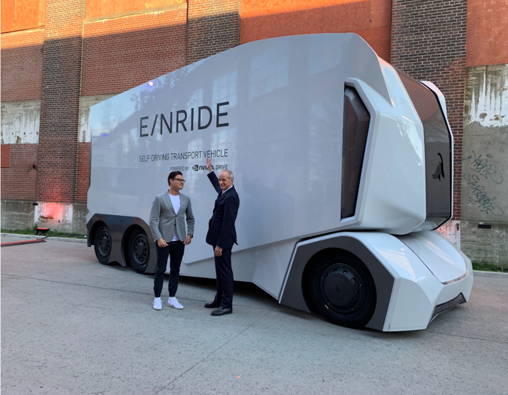 Michelin Group&rsquo;s CEO Florent Menegaux with Einride&rsquo;s Head of Operations, Niklas Reinedahl, in front of the T-pod during the Movin&rsquo;On Summit 2019 in Montreal.