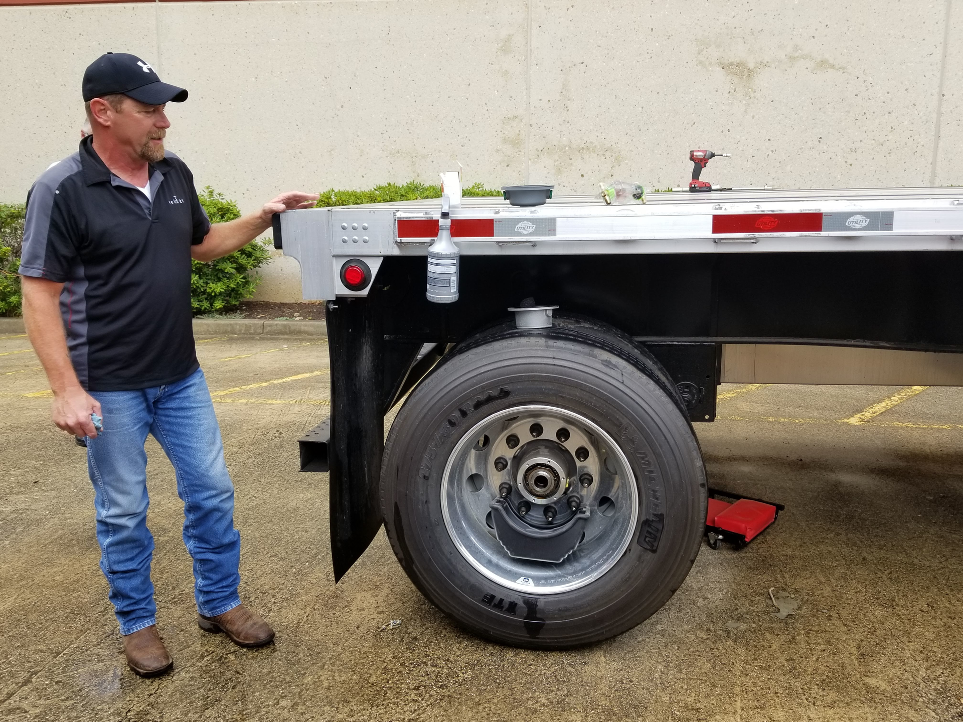 A Velociti representative demonstrates how quickly the MTIS can be retrofitted onto a trailer.