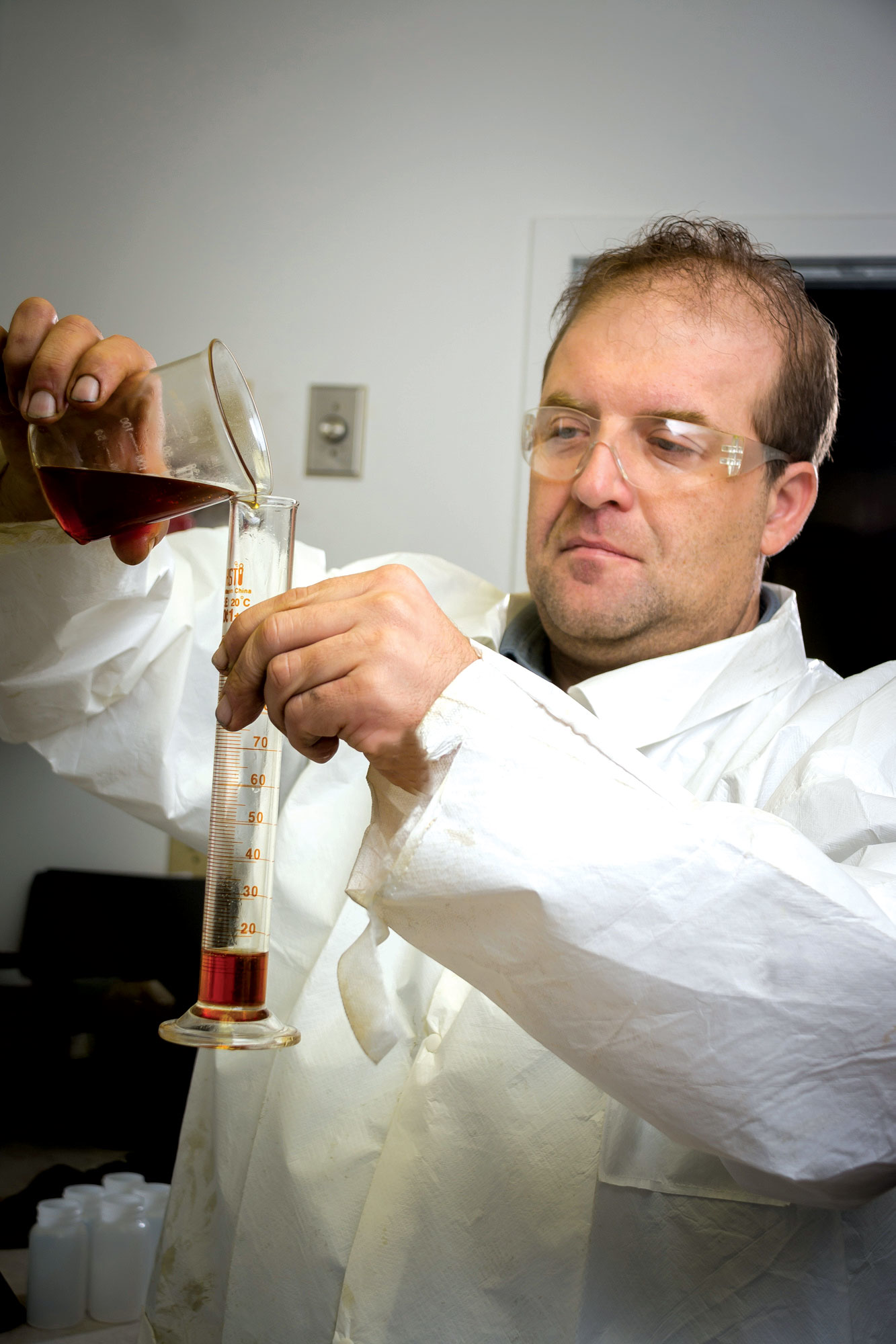 Kevin Adams, vice president of research and development, LSI Chemical, tests a new LSI Chemical oil additive.