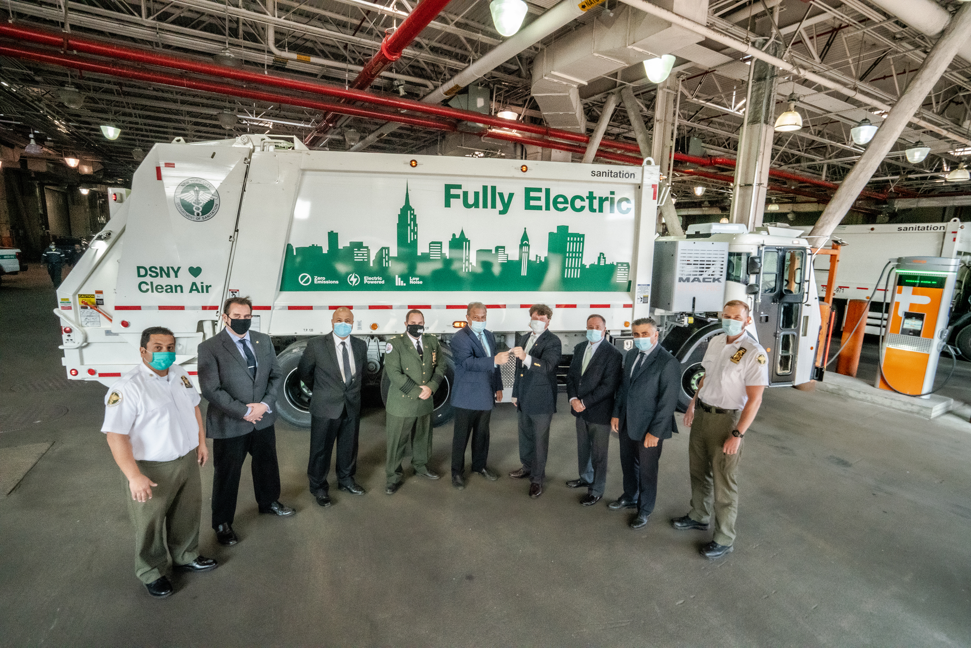 Mack Trucks turned over the keys to its Mack LR Electric demonstration model to DSNY officials. Pictured left to right: DSNY Superintendent Anthony Donofrio; DSNY Deputy Director Michael Matkovic; DSNY Deputy Director Spiro Kattan; DSNY Assist. Chief Joseph Cendagorta; DSNY Deputy Commissioner Rocco DiRico; Mack Trucks National Account Manager John Stuart; Vasso Waste Systems President Tony Vasso; DSNY Deputy Director Giovanni Ianniello; DSNY Superintendent James Anderson.