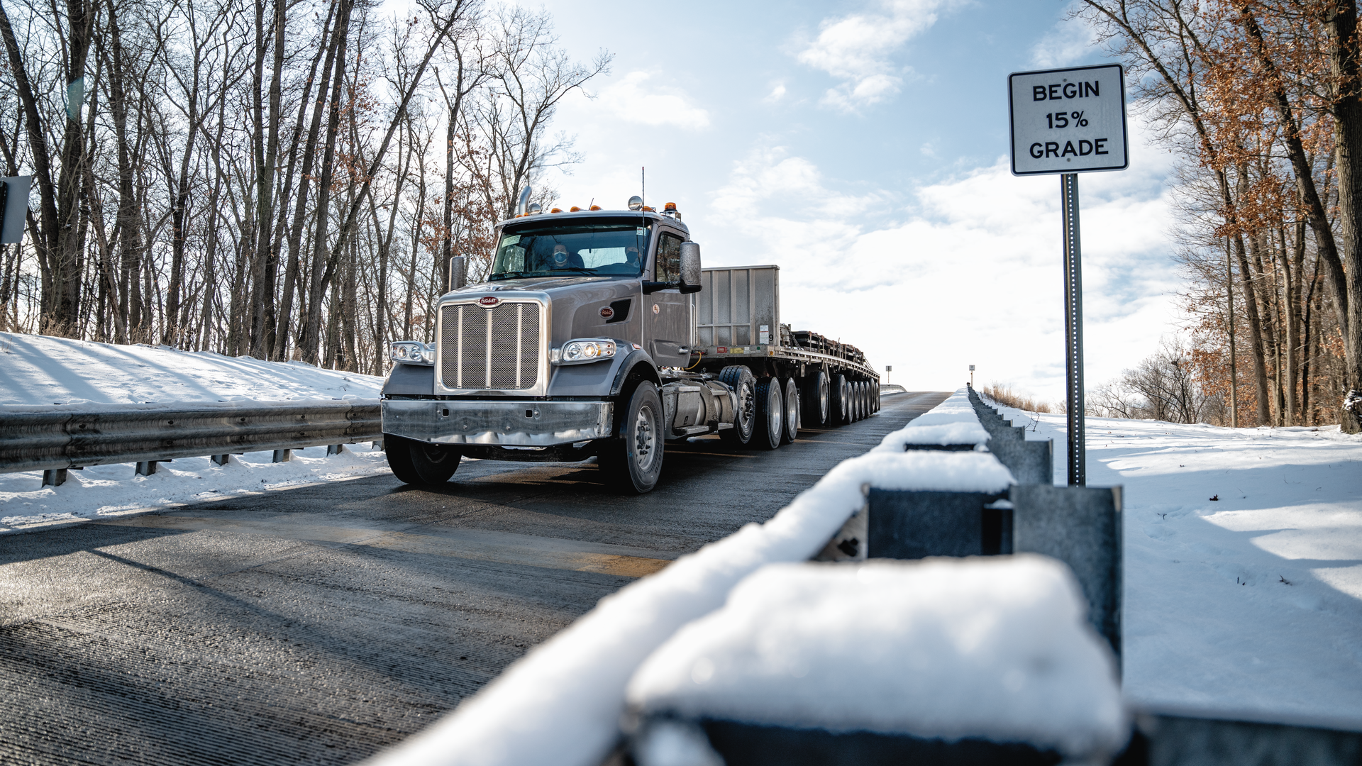 A Peterbilt 567 hauling 140,000 lb. and equipped with the new TX-18 Pro transmission heads downhill on a 15% grade at the Eaton proving grounds.