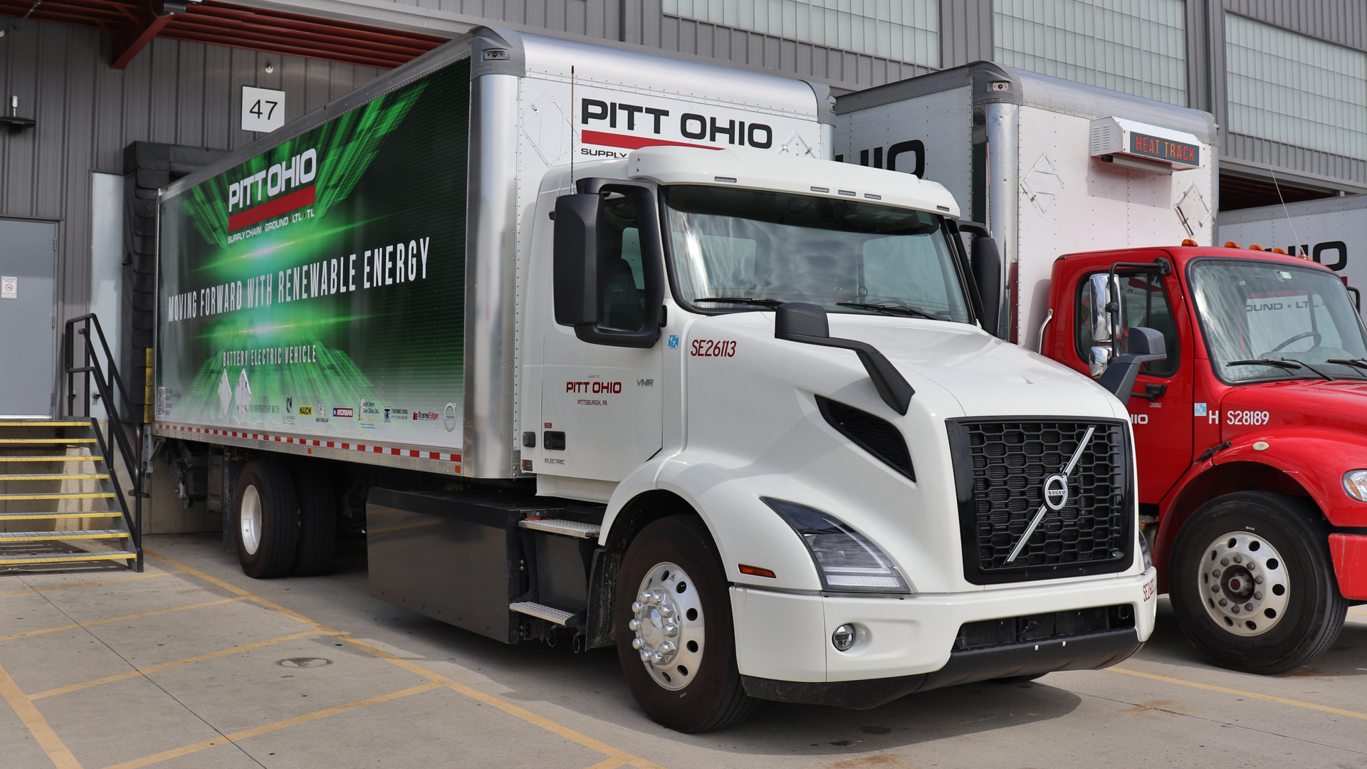 One of Pitt Ohio's two Class 7 Volvo VNR Electrics backed up to the LTL carrier's Cleveland Terminal after a day of pickup and delivery work.