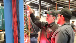 An instructor at NVI-Blairsville teaches a student how to diagnose wire harness issues. An instructor at NVI-Blairsville teaches a student how to diagnose wire harness issues.
