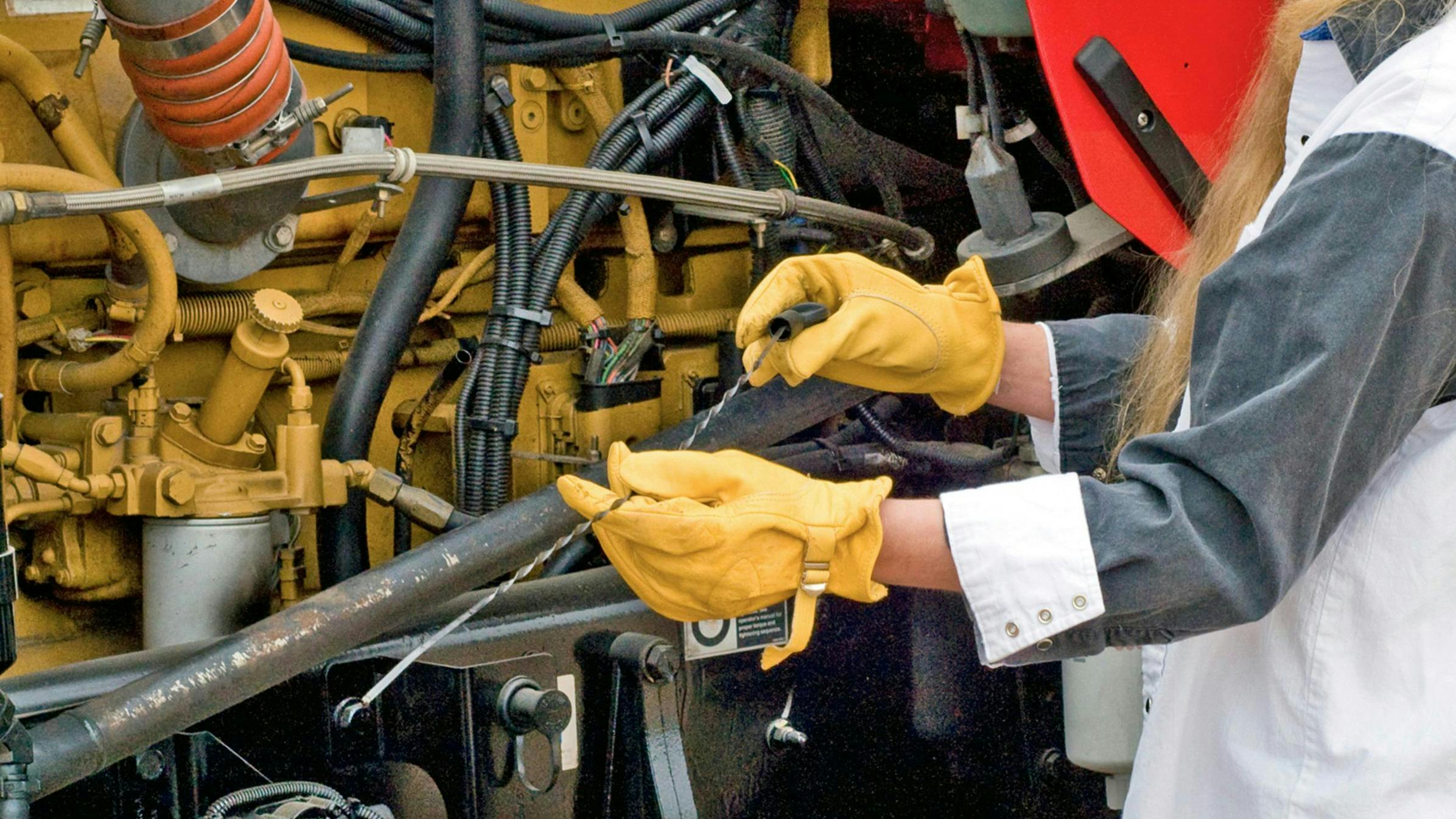 checking oil-level-dreamstime-167667373