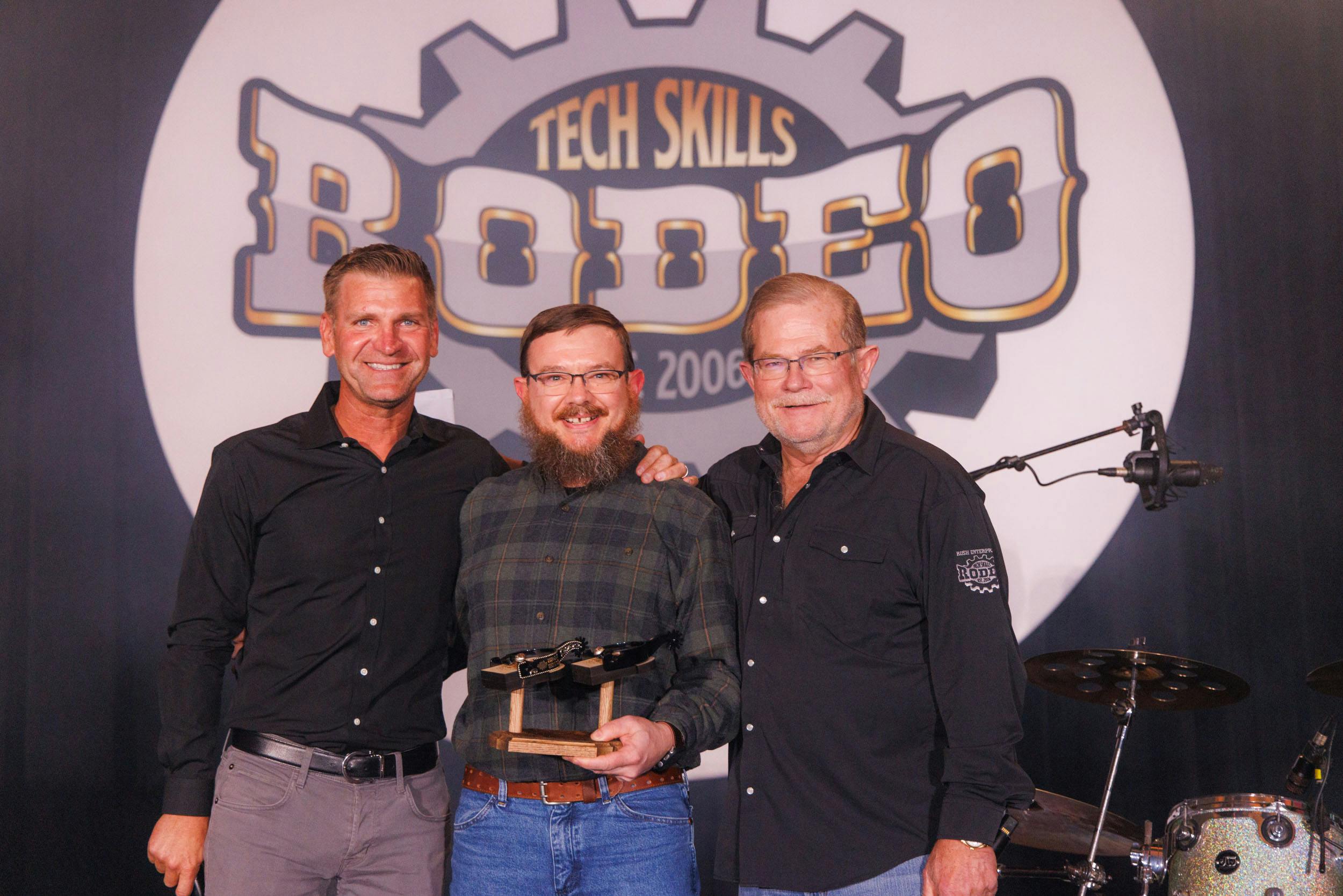From left to right, retired NASCAR driver and current broadcaster Clint Bowyer, Christopher Purcell, and Rush CEO and President W.M. &ldquo;Rusty&rdquo; Rush.