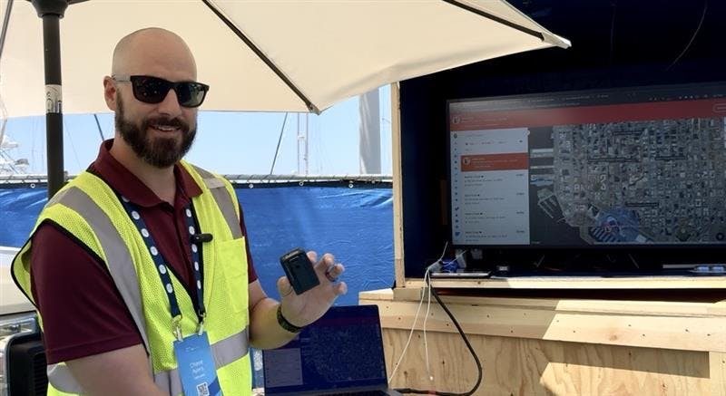 Chris Ayers, field sales engineer with Samsara, demonstrates the SOS capabilities of the company's new Wearable worker safety device.