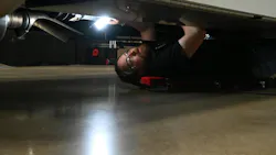 Technician under truck Rush rodeo top maintenance concerns Technician under truck Rush rodeo top maintenance concerns