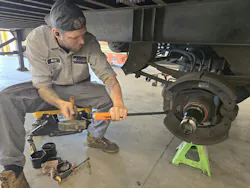Nicholas Graves, a trailer technician at Transport Services, removing an S-Cam spring prior to a brake replacement. Nicholas Graves, a trailer technician at Transport Services, removing an S-Cam spring prior to a brake replacement.