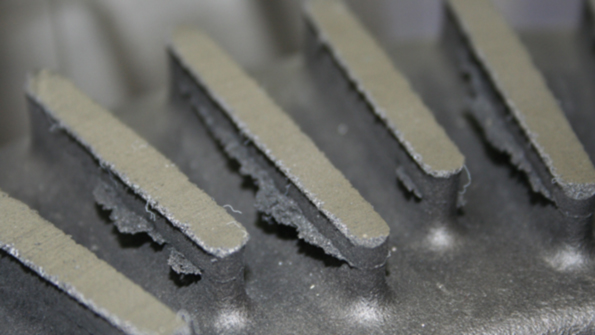 Veining is caused by the expansion of silica sand during casting This photo shows some typical effects of veining on a disc brake casting