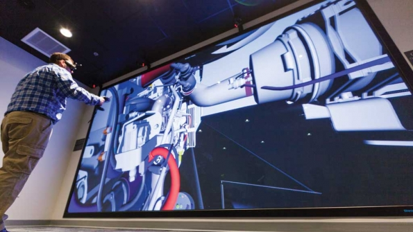 An engineer checks a design at the 8X16 lsquopowerwallrsquo at AGCOrsquos design center in Jackson MN