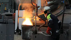 Pouring molten metal at William Cook Cast Products in Sheffield England Pouring molten metal at William Cook Cast Products in Sheffield England