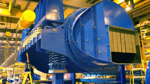 The General Kinematicsrsquo VIBRADRUMreg features a ldquotwomass subresonant tunedrdquo system that compensates for variations in load size and weight Its continuous tumbling action loosens sand from castings and accelerates casting cooling by equalizing the sandcasting temperatures and evaporating moisture