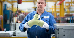 Aeromet Intl worker w/prototype Aeromet Intl worker w/prototype