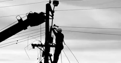 Lineman servicing a power line. Lineman servicing a power line.