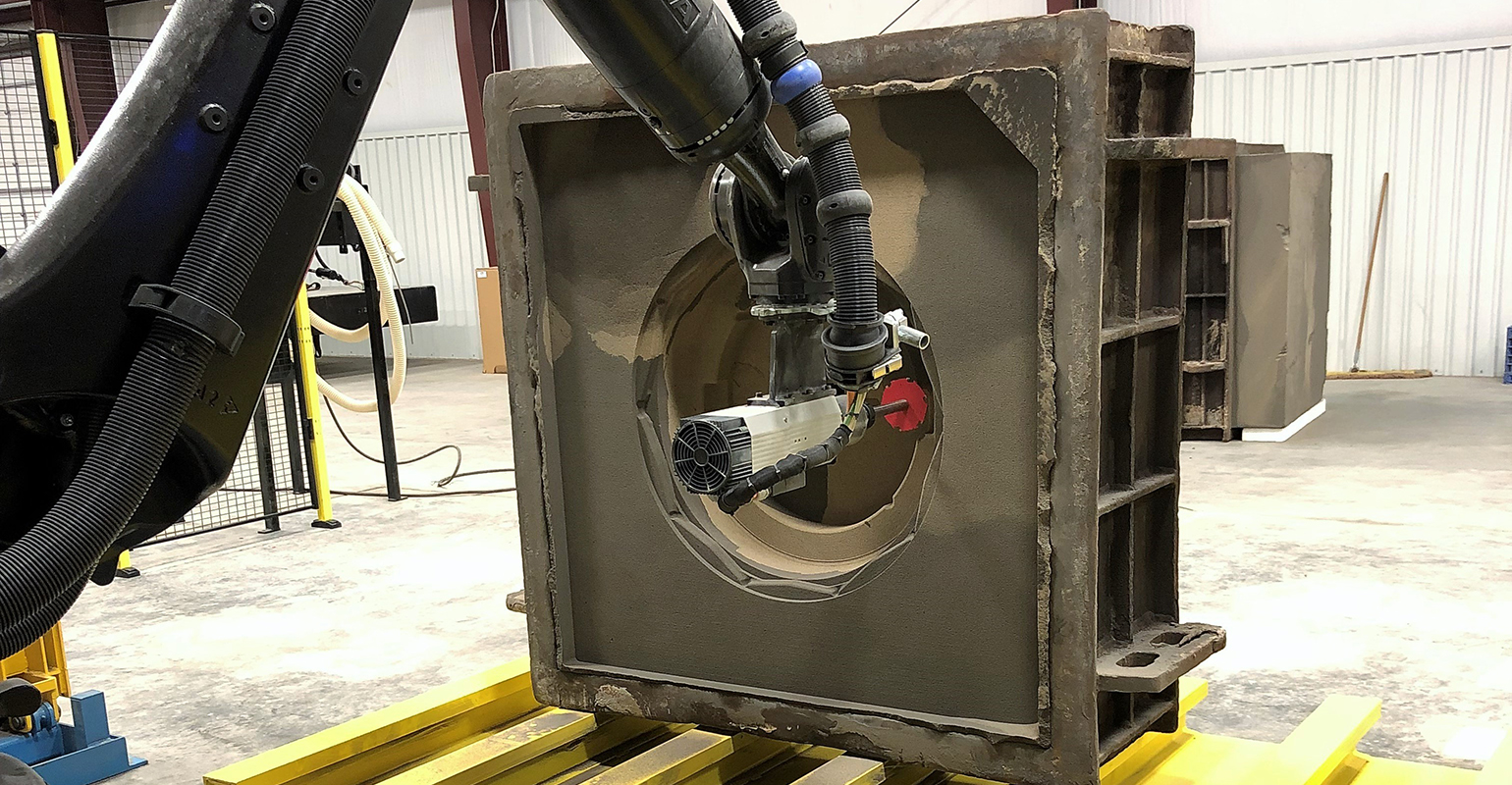 The KUKA robot can create most sand mold geometries that typically would involve multiple cores or structural parts, according to QESC.