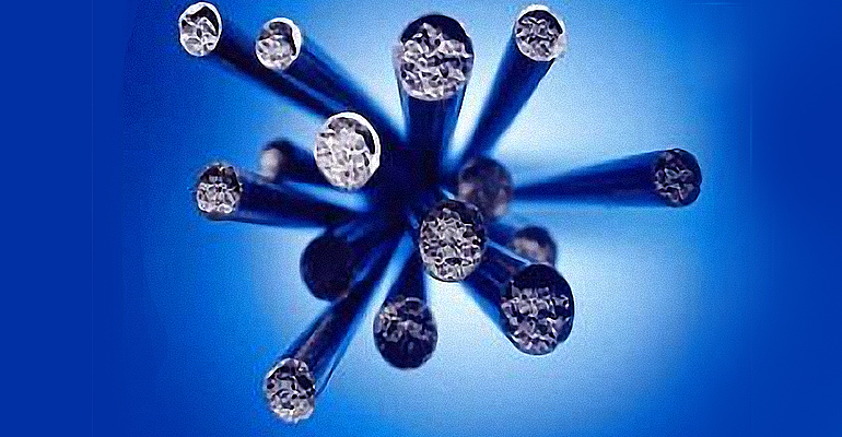 Cored-wire practice introduces a hollow wire filled with powder alloys to the lade to treat or inoculate molten iron.