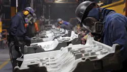 Workers grind engine castings at Teksid Hierro, a gray and ductile iron foundry. Workers grind engine castings at Teksid Hierro, a gray and ductile iron foundry.