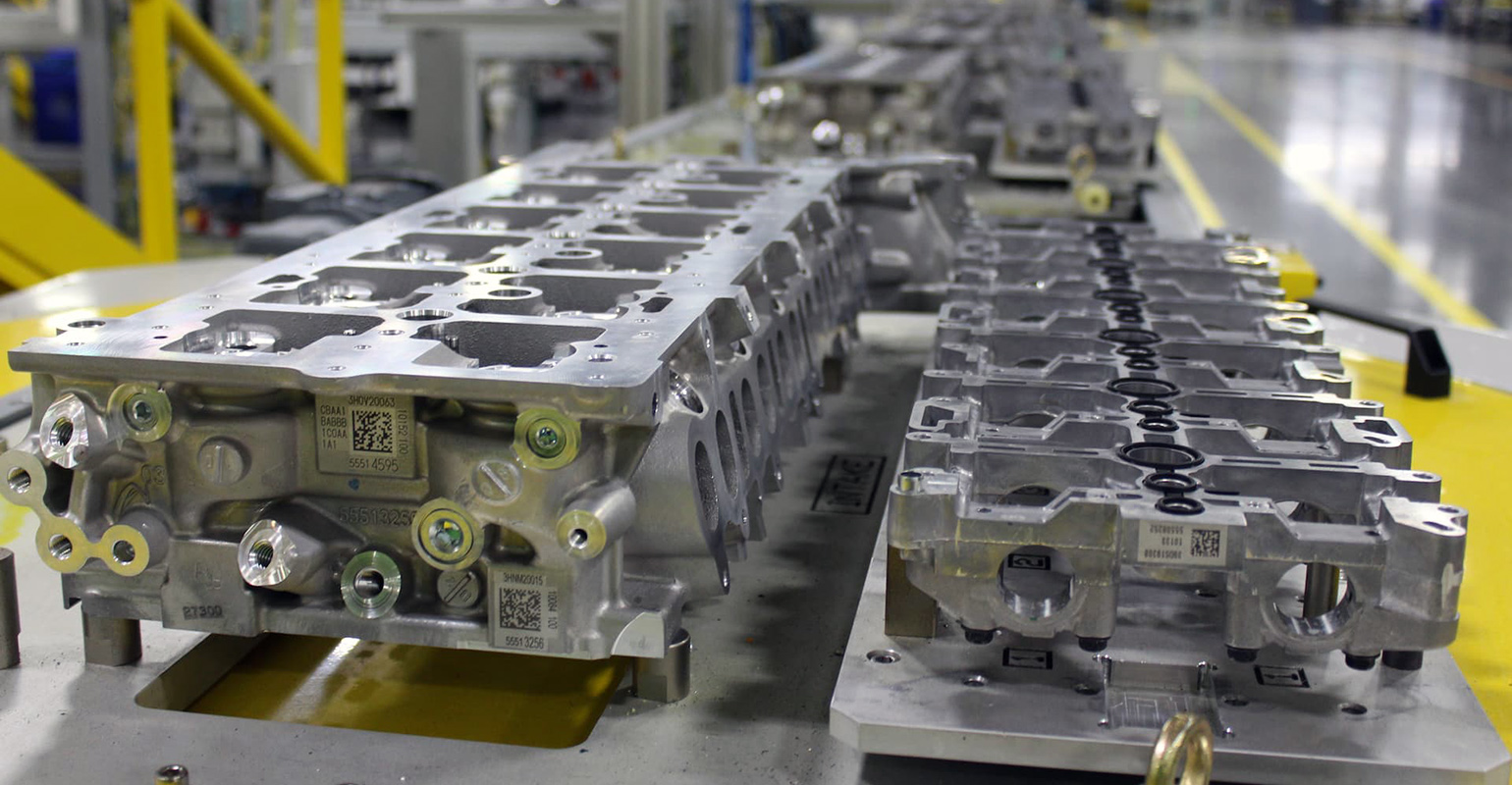 Cast aluminum cylinder heads on a rack at GM Flint Mich. engine plant.