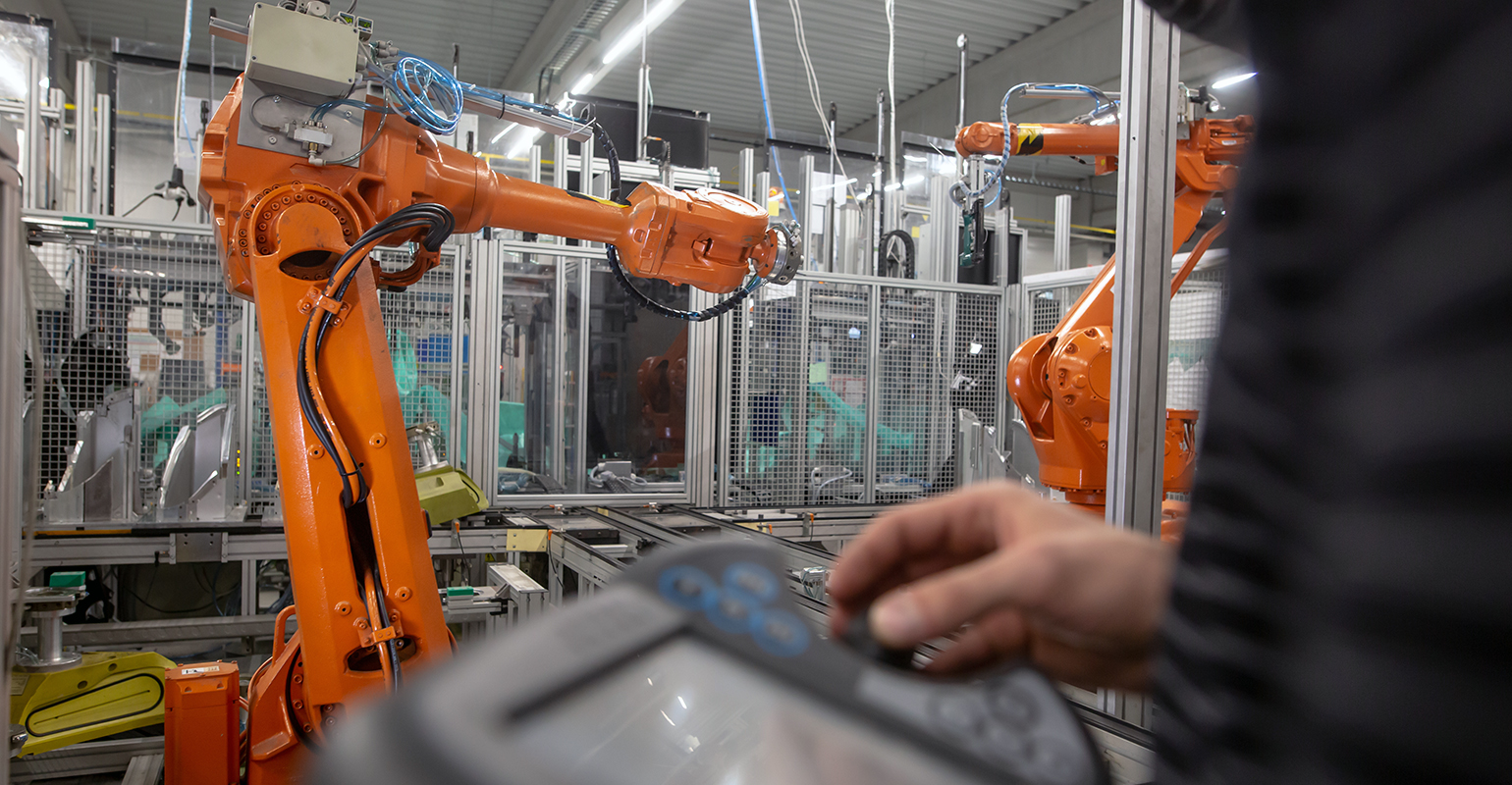 Programming a robot in an automotive manufacturing workcell.