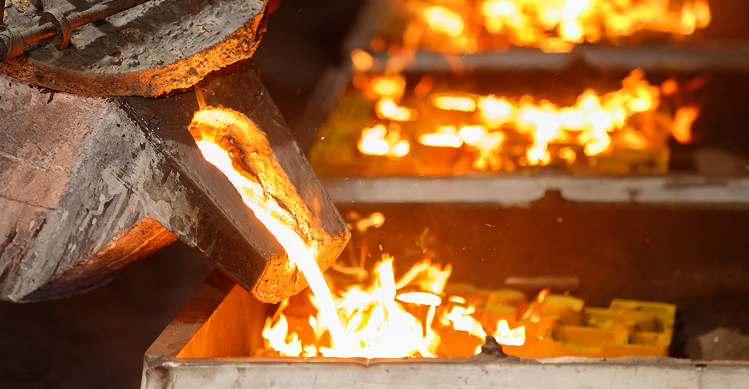 Pouring molten iron.