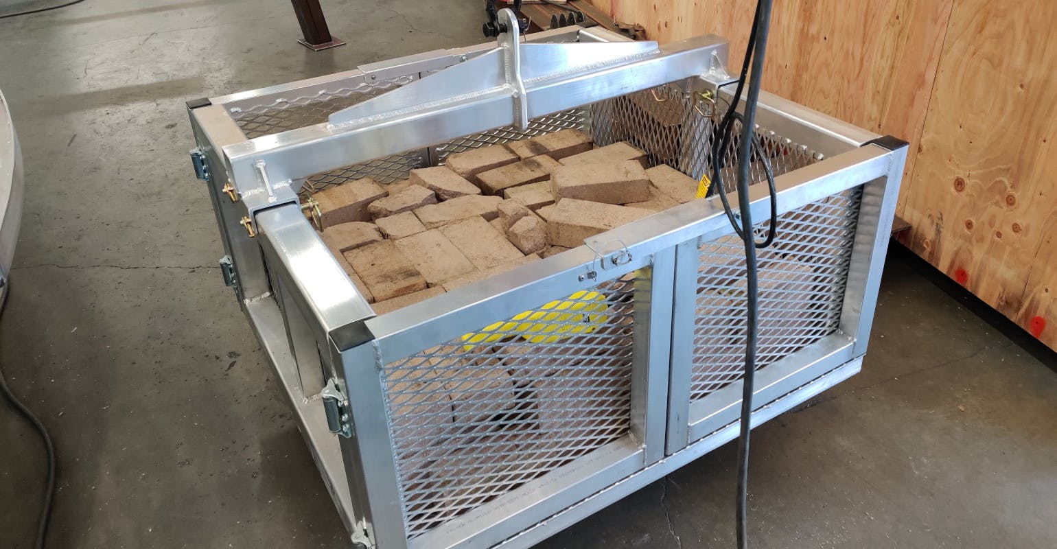 The heavy-duty capacity of the material basket allows the basket to lift as much as 10,000 lbs. (4,535 kg), enough to stack two pallets of refractory brick onto each other.