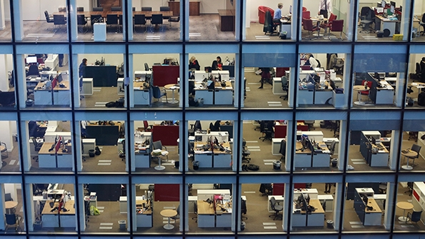 People work at dusk on various floors of a modern office development near St Paul39s Cathedral in London on Feb 6 2013 Photo by Oli ScarffGetty Images