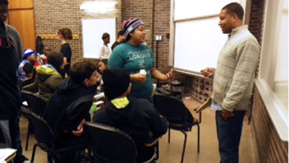 Jason Coleman confers with a group of highschool students