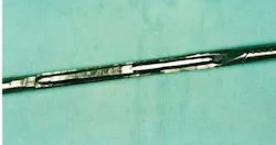 Cutaway of a laparoscopic instrument showing bioburden trapped inside of the square corners Cutaway of a laparoscopic instrument showing bioburden trapped inside of the square corners