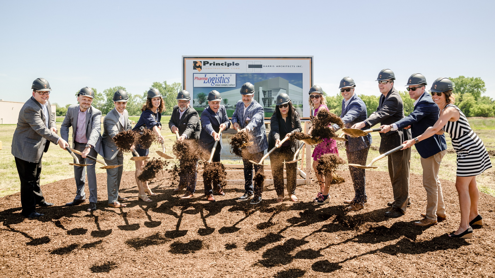 Pharma Logistics breaks ground for its new structure. Eleven executives from Pharma Logistics, along with one executive from the construction company and a village trustee, participated in the event. They are (from left to right): Jeff Swanson, Head of Customer Success; Eric Helbig, Head of Retail Sales; John Shalaby, Head of Service; Cristina Abbagnaro, Head of Culture & Team; David Malecki, Head of Fulfillment; Jim Brucato, President, Principle Construction; Michael Zaccaro, President & CEO; Donna Johnson, Senior Village Trustee of Libertyville; Daniela Weiszhar, Head of Marketing & Communications; Matthew Clausing, Head of Reconciliation; Vince Paul, Head of Tech Ops & App Engineering; Eric Kessel, Head of Hospital Sales; and Jennifer Dodge, Head of Administration