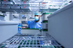 Tech II Charles Jones places a sterile tray inside of the sterile storage area. Tech II Charles Jones places a sterile tray inside of the sterile storage area.