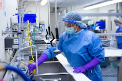 Tech I Season Whiting prepares sinks to begin decontamination process. Tech I Season Whiting prepares sinks to begin decontamination process.