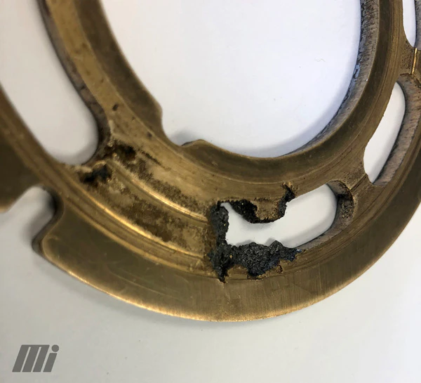 Heavy cavitation on valve plate.
