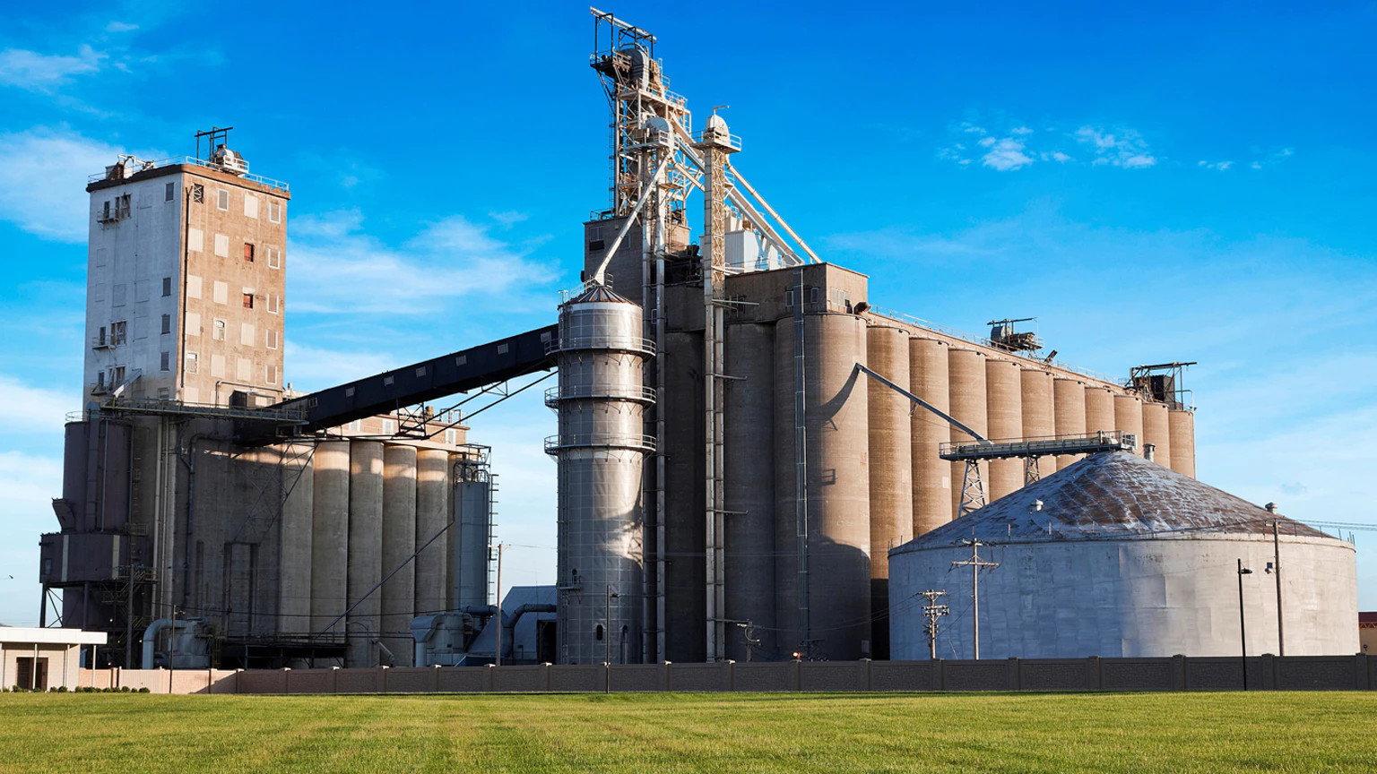 In a typical bulk product operation such as seed processing, bottlenecks throughout the plant can occur at the dispensing gates, which are often opened and closed pneumatically or hydraulically.