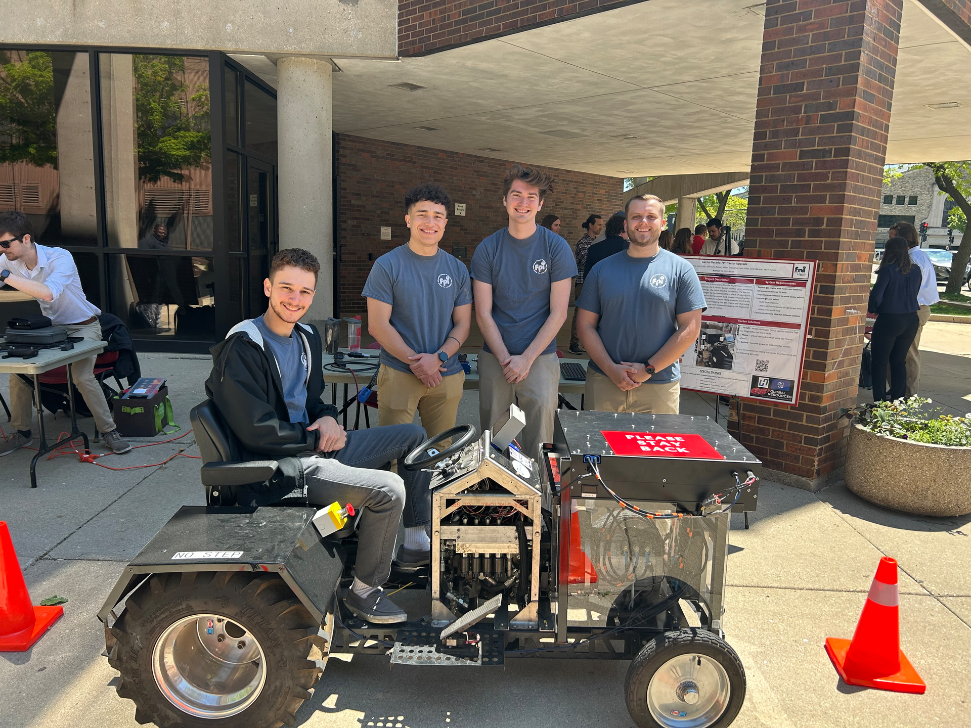 Electrical engineering students at MSOE showcase their tractor which was converted to electric power.
