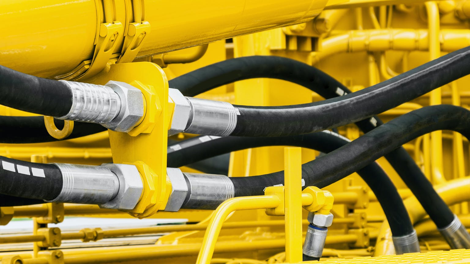 hydraulic hoses on heavy machinery