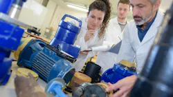 engineers looking at components engineers looking at components