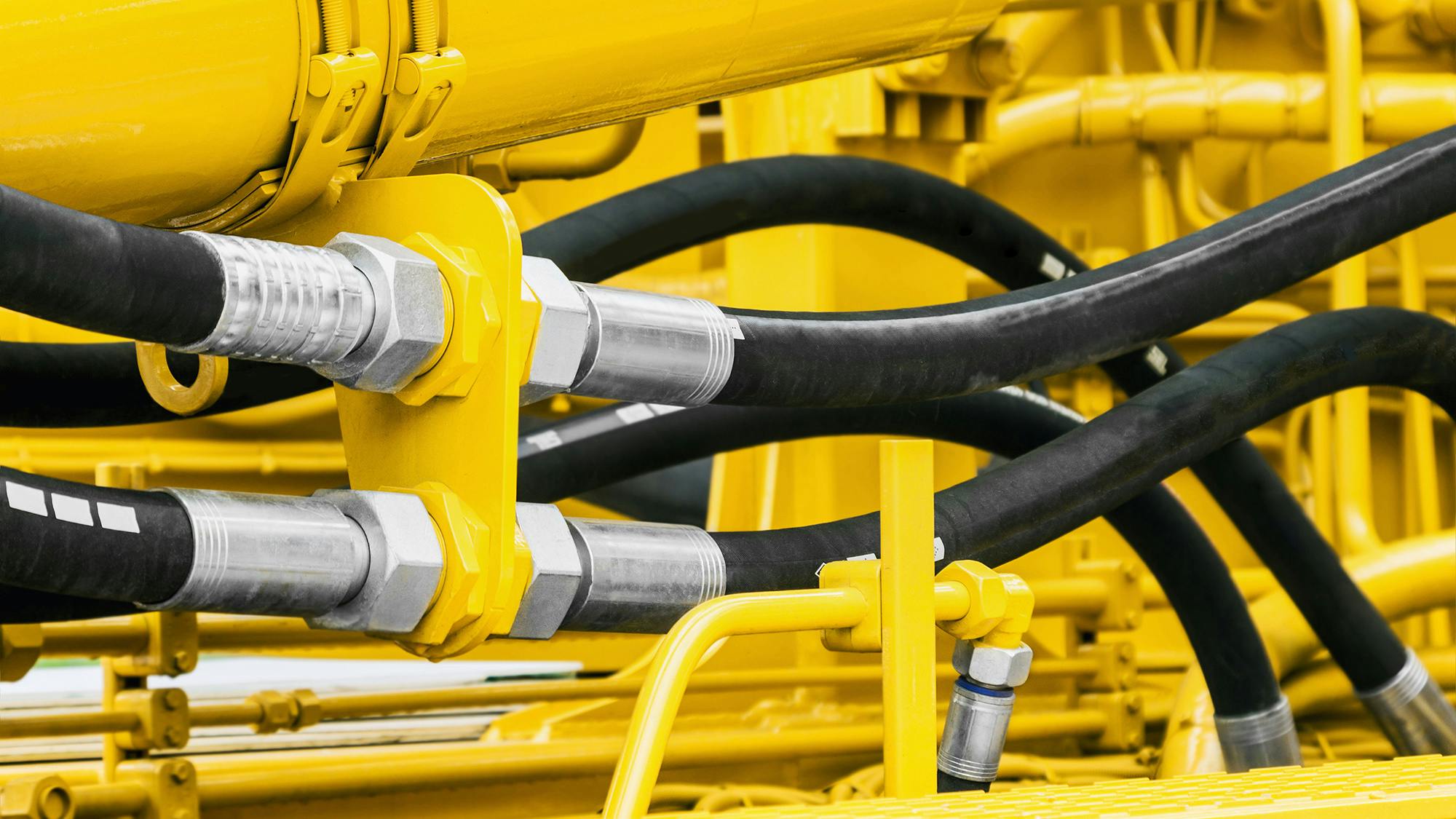 The hydraulic systems on construction equipment and other heavy machinery enable various functions such as the lifting of an excavator boom.