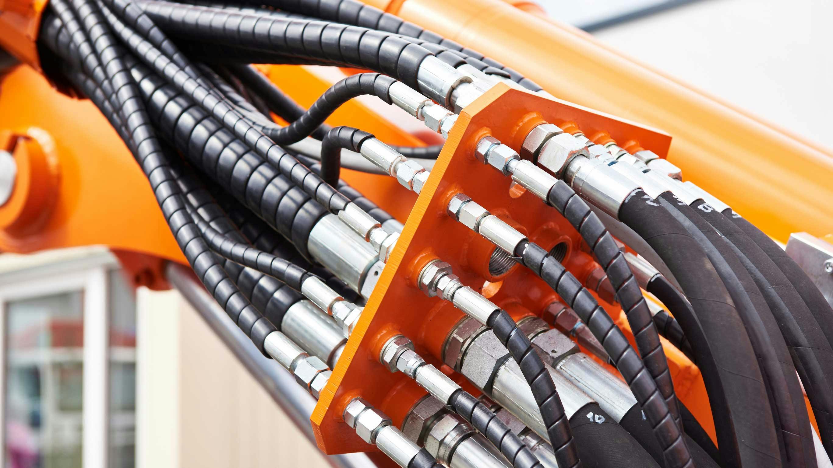 Hydraulic hoses and fittings on a machine