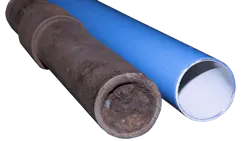 A clogged iron compressed air pipe next to an unclogged pipe A clogged iron compressed air pipe next to an unclogged pipe
