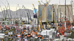 An aerial view of an outdoor exhibition lot at CONEXPO 2023 with various types of construction machines An aerial view of an outdoor exhibition lot at CONEXPO 2023 with various types of construction machines