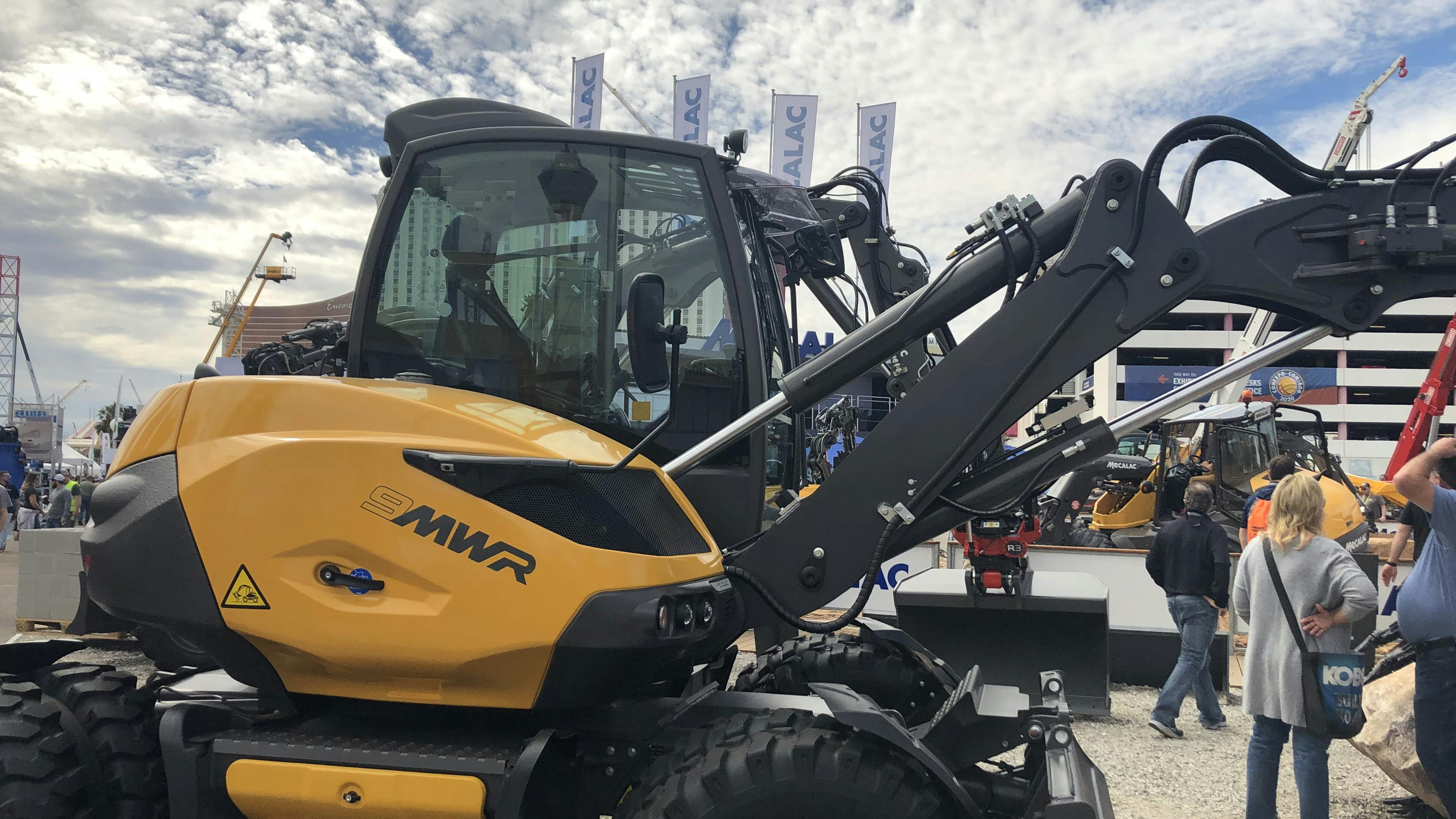 A close up view of hydraulic cylinders on the arm of an excavator
